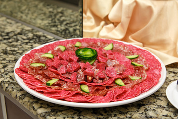 Dish with sliced meat products