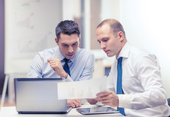two businessmen having discussion in office
