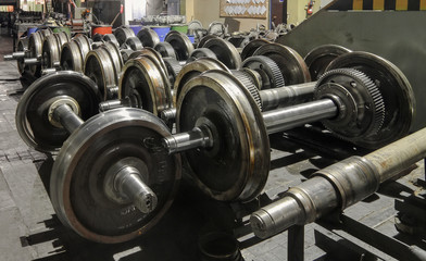 Many wheelset standing on the floor. Details of the train wheel