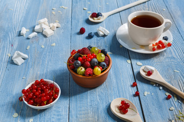 Breakfast with baked pea and berries at blue rustic wood