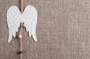 Linen background with angel wings