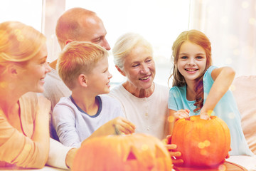 Fototapeta na wymiar happy family sitting with pumpkins at home
