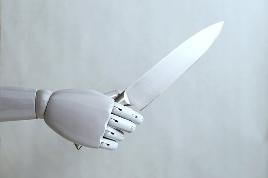 artificial intelligence hand holding a knife