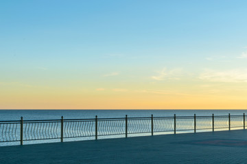 Fototapeta na wymiar A deserted boardwalk town of Zelenogradsk on the dawn. The view of the Baltic sea