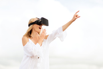 woman in virtual reality headset pointing finger