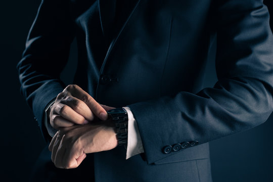 Businessman Checking Time From Watch