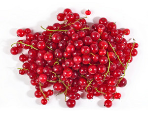 Heap of fresh red currant close up on a white