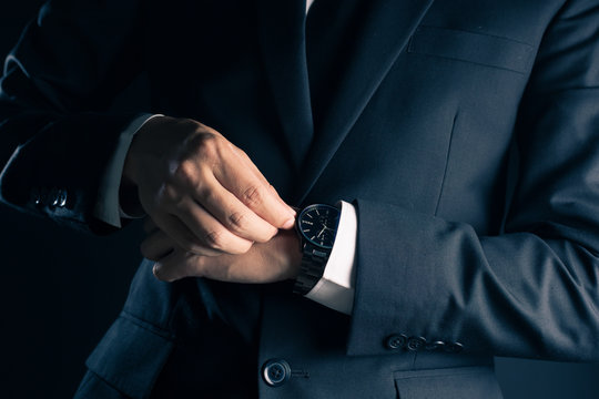 Businessman Checking Time From Watch