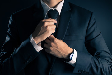 Businessman Adjust Necktie his Suit