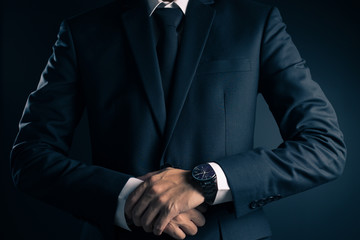 Businessman in Black Suit on Isolated Background