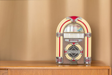 classic radio / classic radio on wood table with curtain background 