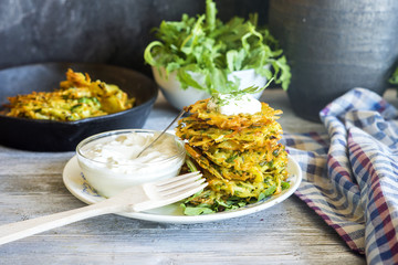 Potato fritters (draniki) served with sour cream