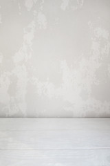 White plastered wall and wooden floor background. Mix of two textures, home repair concept, free space