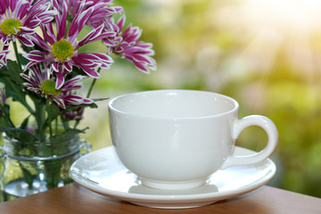 White cup coffee in the morning time.