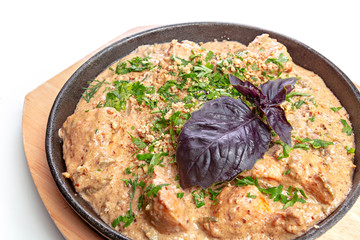 Isolated chicken with vegetable on frying pan