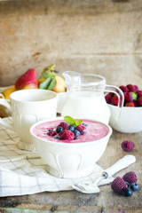 Healthy paleo vegetarian berry mousse porridge with semolina and berry puree for breakfast