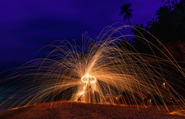 Burning steel wool on stone near the beach.