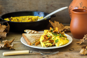 Eggs omelette with chanterelle mushrooms, rustic style..