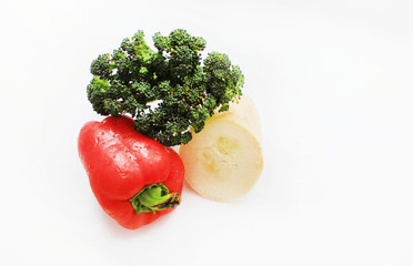 Fresh organic vegetables broccoli red bell pepper and squash cooking ingredients for home made meal isolated on white background with empty copy space. Healthy eating dietary food concept