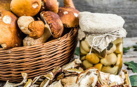 Autumnal mushrooms, boletus marinated in jar and dry mushroom on