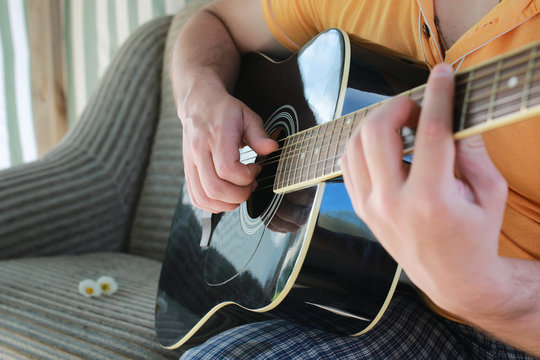 guitar string man hand outdoor