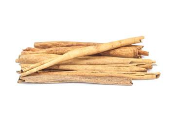 Cinnamon sticks on wooden spoon