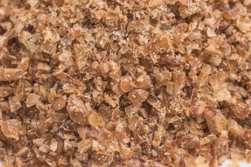 Ground Wheat into a spoon. Trigo para quibe. Kibbeh