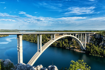 Fototapeta na wymiar Concrete arch bridge over the river Krka near Skradin and the Krka National Park, carries A1 motorway, Dalmatia, Croatia