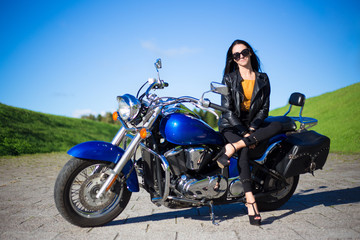 Naklejka na ściany i meble young beautiful woman sitting on retro motorcycle