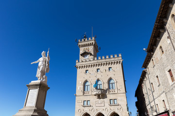 Fototapeta na wymiar Central square of San Marino. Public Palace and statue of Liberty