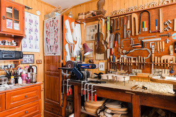 Tools, paint and varnish in workshop of instrument maker