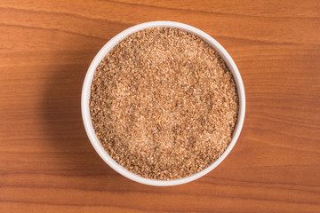 Ground Wheat into a spoon. Trigo para quibe. Kibbeh