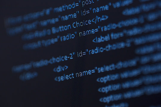 code text on a computer screen. Image taken in a small angle.
