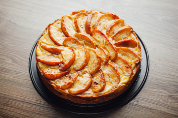apple tart cake on wooden table top