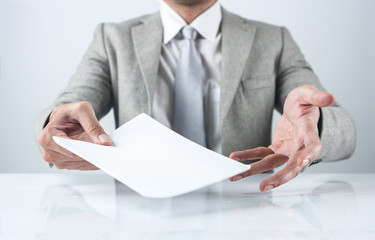 Businessman giving paper
