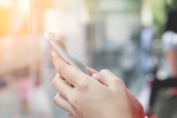 Close up Young girl using smartphone, Hand holding mobile phone for technology background