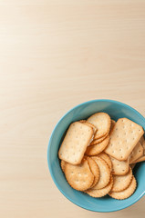 crackers cheese and crackers sugar in color bowl on wood table,