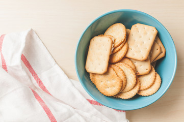 crackers cheese and crackers sugar in color bowl on wood table,