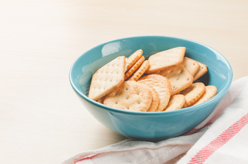 crackers cheese and crackers sugar in color bowl on wood table,