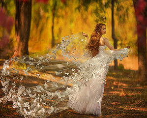 Beautiful bride in the autumn park