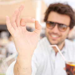 Young man drinking a beverage