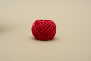Red atangle thread on dark background - fabric