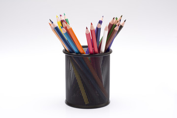 Colourful pencils in holder with isolated on white background