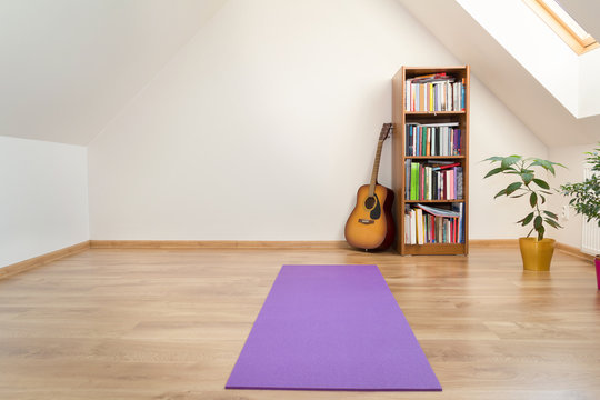 Yoga Mat In Empty Loft Room Interior