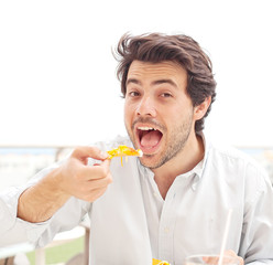 Young man eating nachos