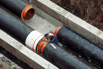 Welding a pipes on a mainheating construction site