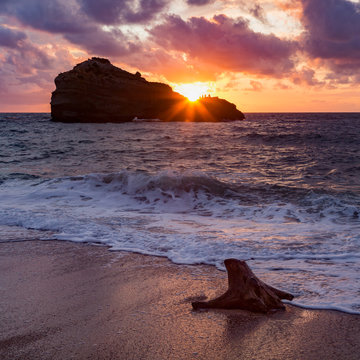Sunset over Roche Ronde rock off the coast of Biarritz, Pyrenees Atlantiques, Aquitaine, France