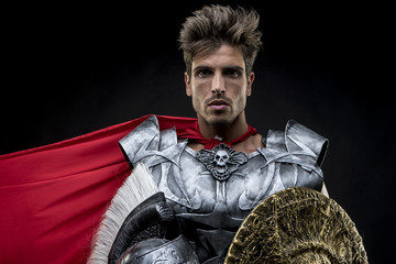 centurion or Roman warrior with iron armor, military helmet with - obrazy, fototapety, plakaty