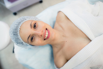 Fototapeta na wymiar beautiful patient woman smile lying on bed in surgery room hospital