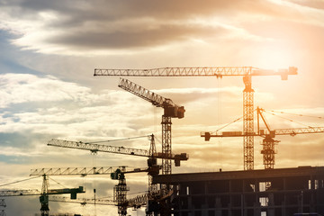 Building construction site at sunset